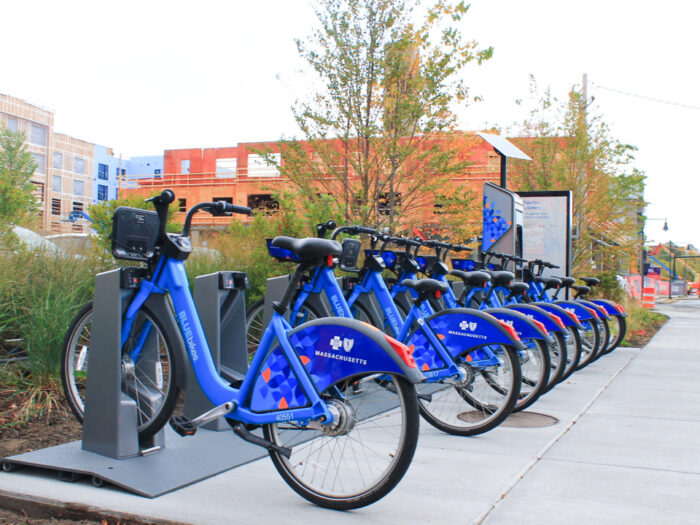 Bike Rack Full of Blue Bikes for Rent Massachusetts Blue Cross Blue Shield