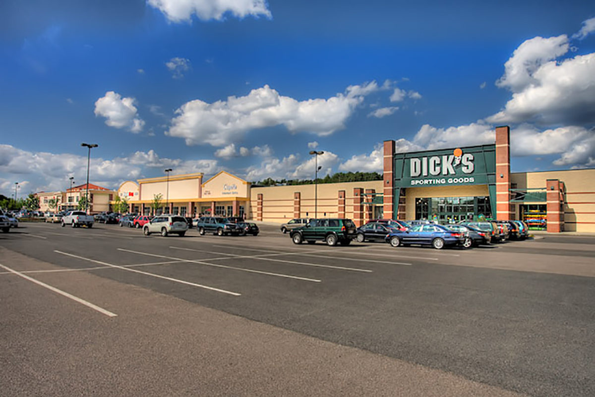 Dedham Mall view of shops from parking lot