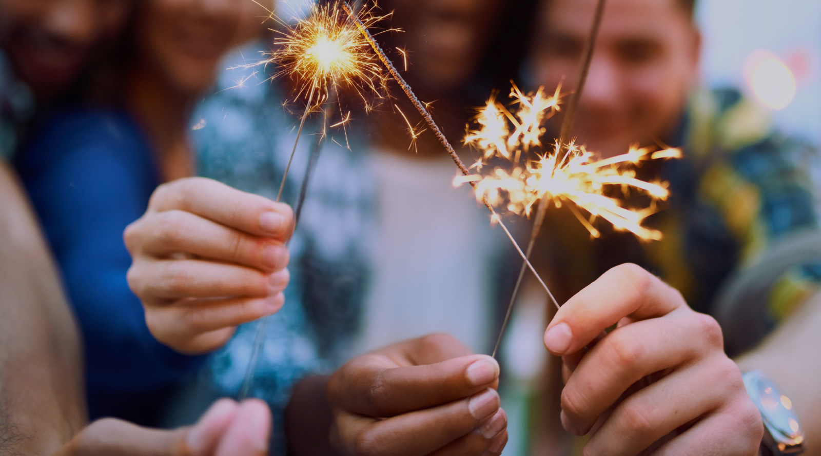 Friends holding sparklers